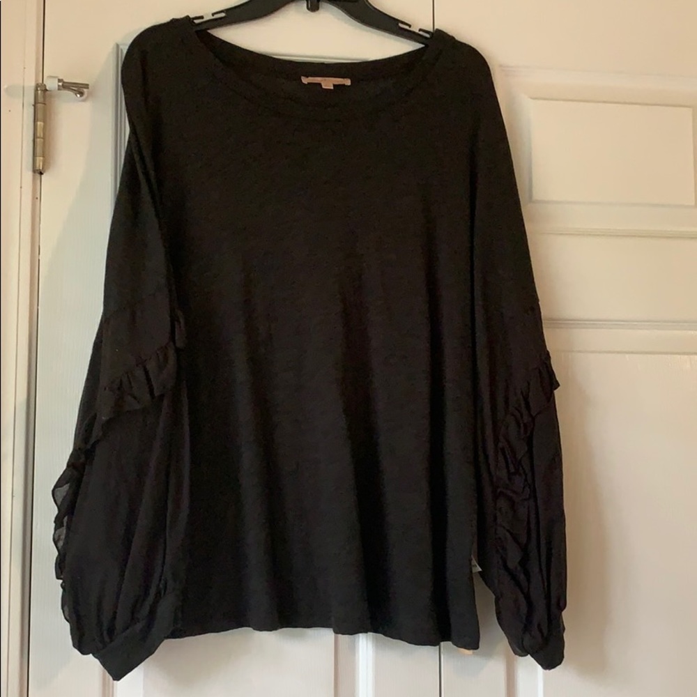 Black, dolman top with ruffle sleeves.